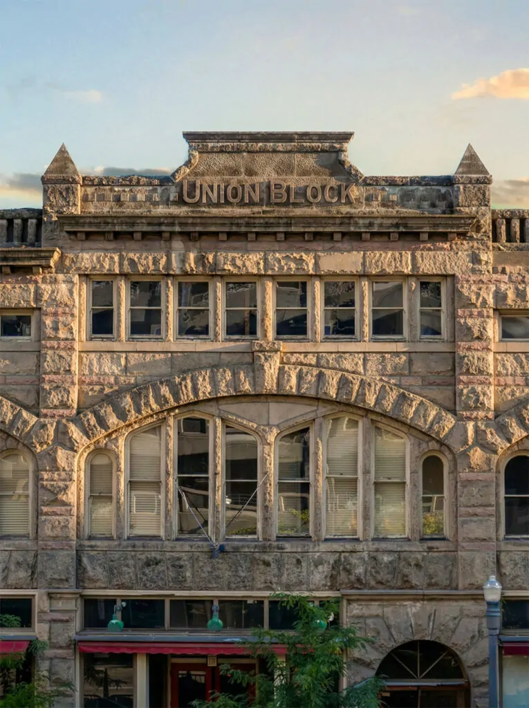 Historic Union Block building in downtown Boise, Idaho, featuring Romanesque Revival sandstone architecture and large arched windows.