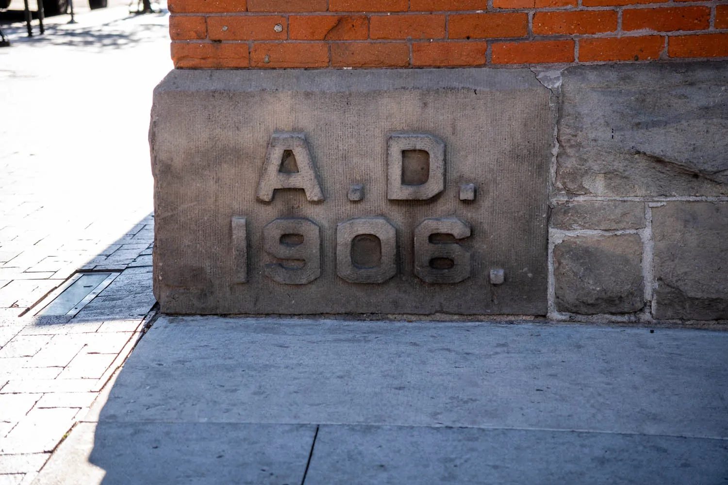 Stone foundation in downtown Boise marked “A.D. 1906,” showing a durable remnant of the city’s early built inheritance.